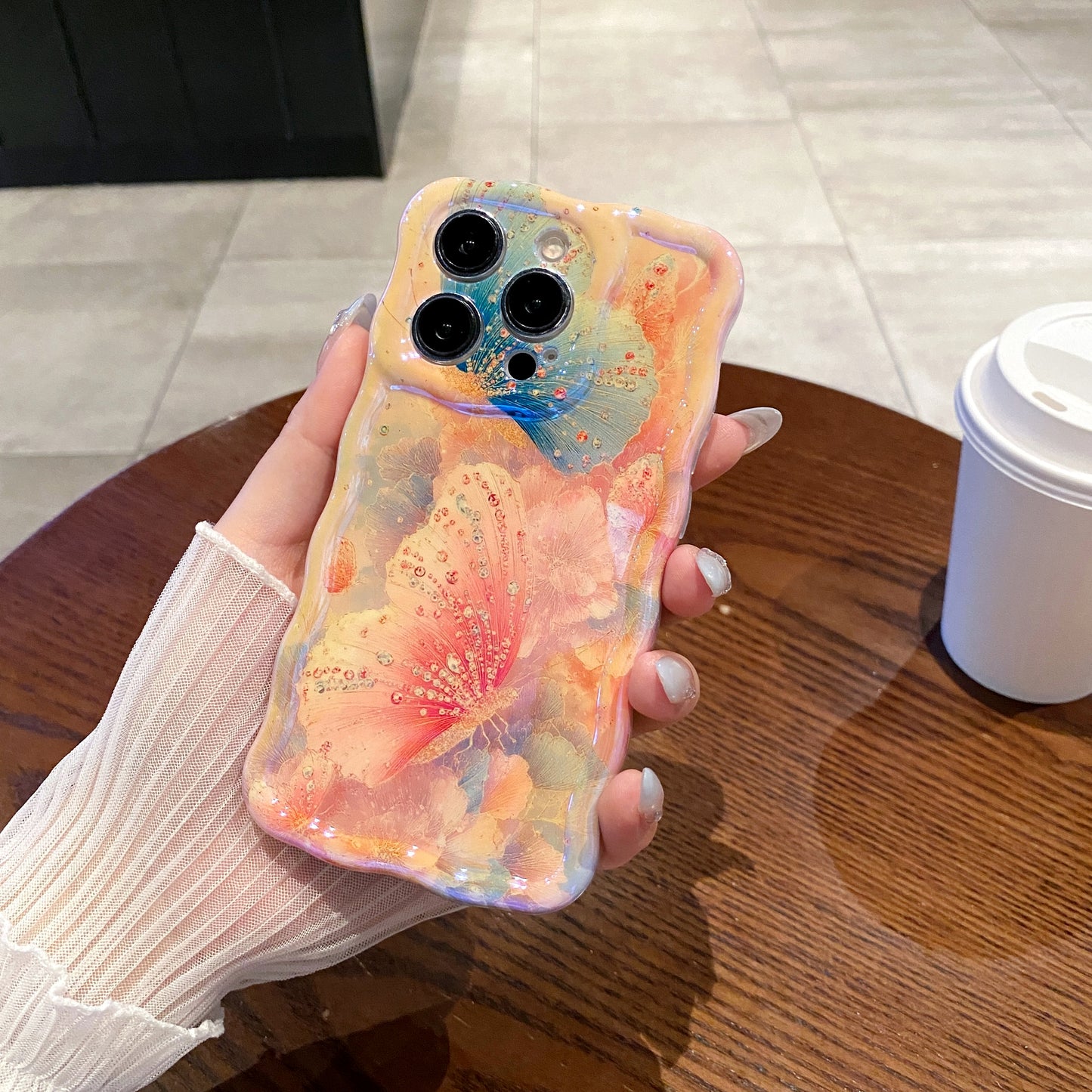 Apricot Butterfly iPhone Case in hand