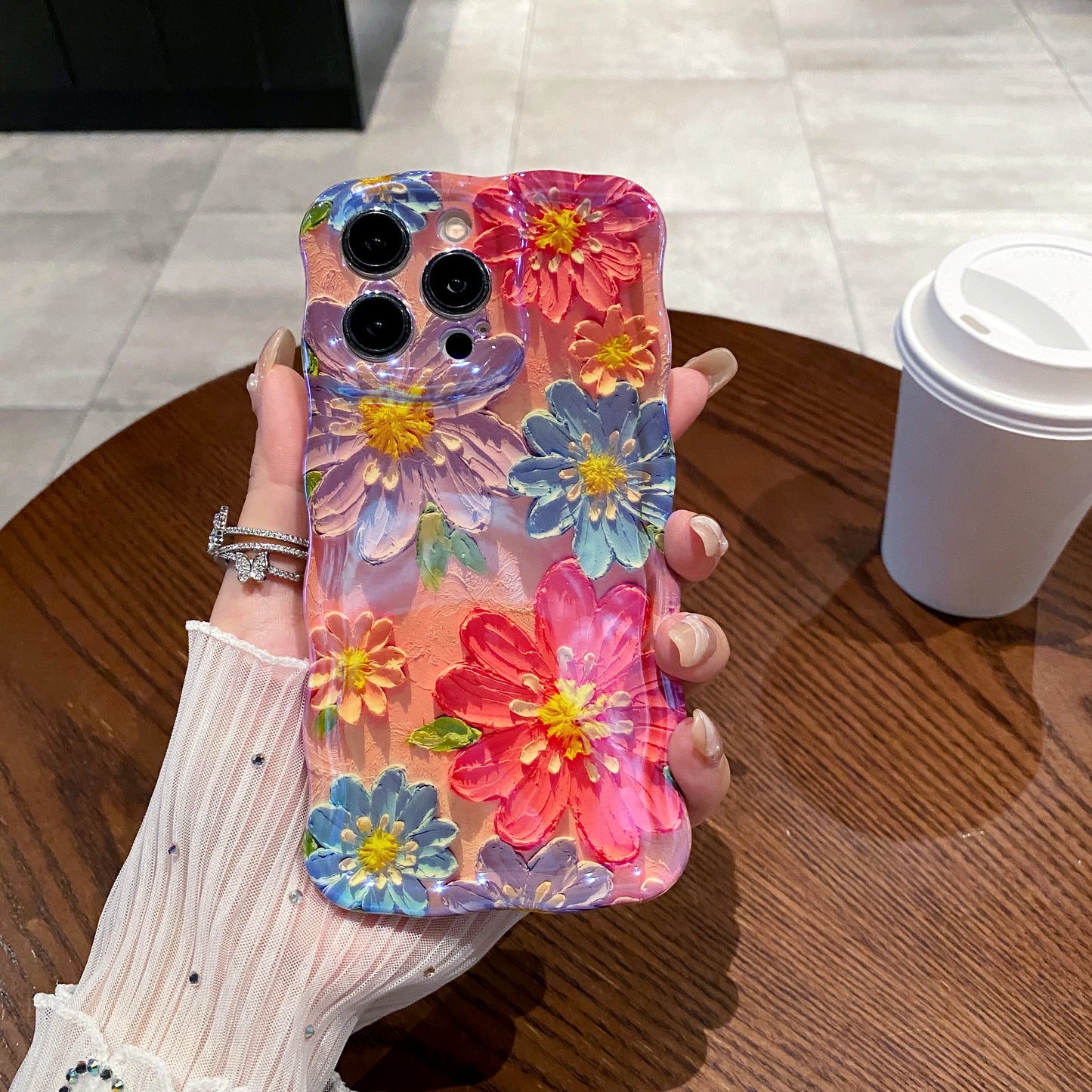 Pink & Blue Daisies iPhone Case in hand