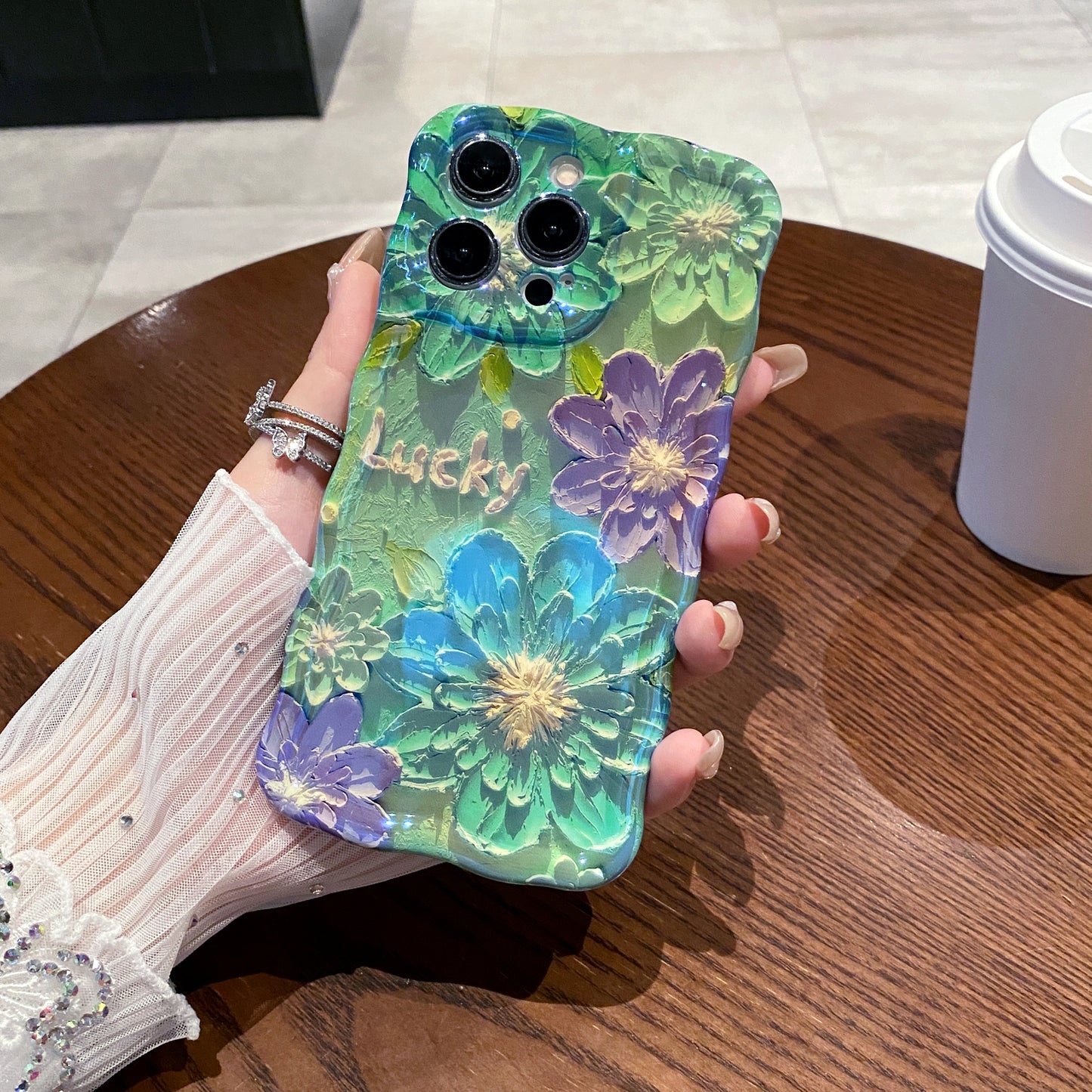 Lucky Garden Green iPhone Case in hand
