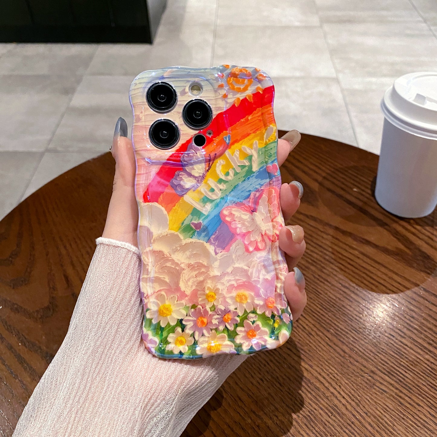 Lucky Rainbow iPhone Case in hand
