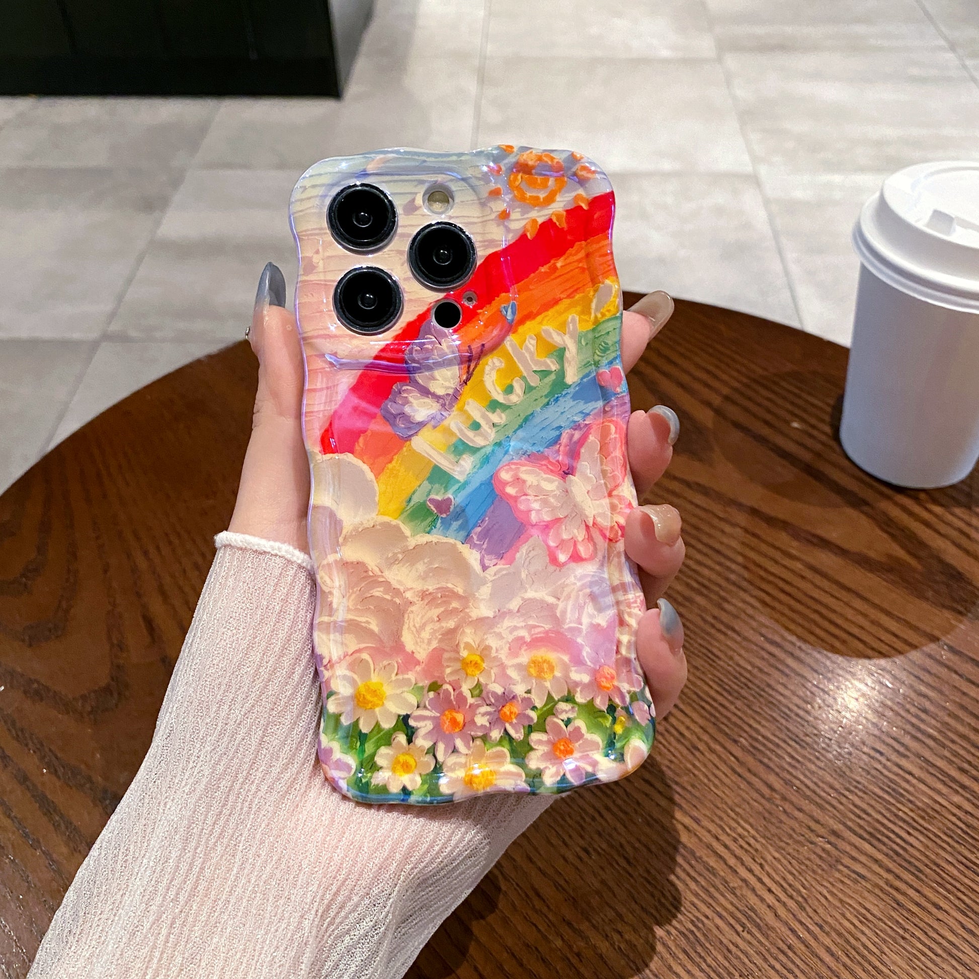 Lucky Rainbow iPhone Case in hand