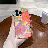 Coral & Purple Blooms iPhone Case in hand