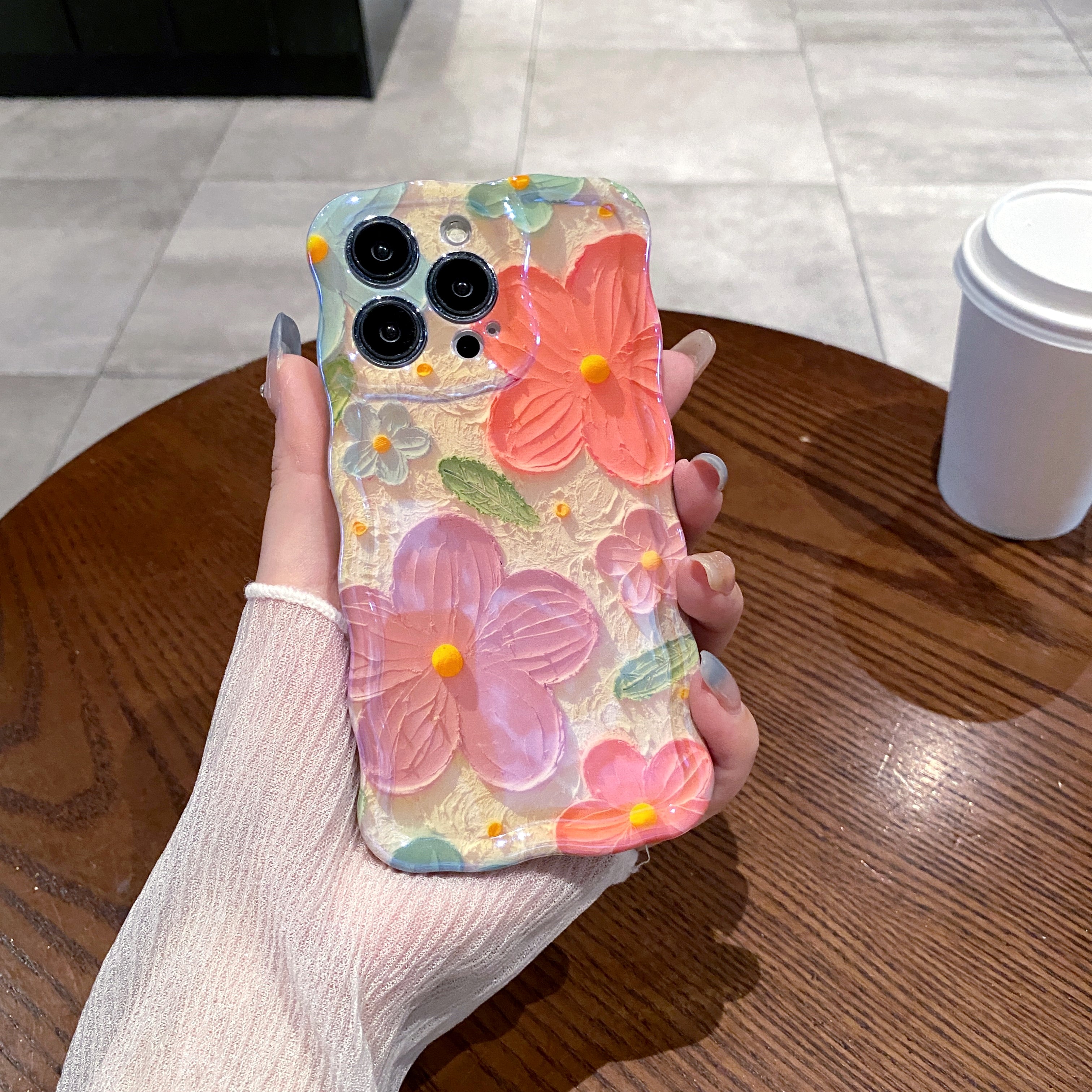 Coral & Purple Blooms iPhone Case in hand