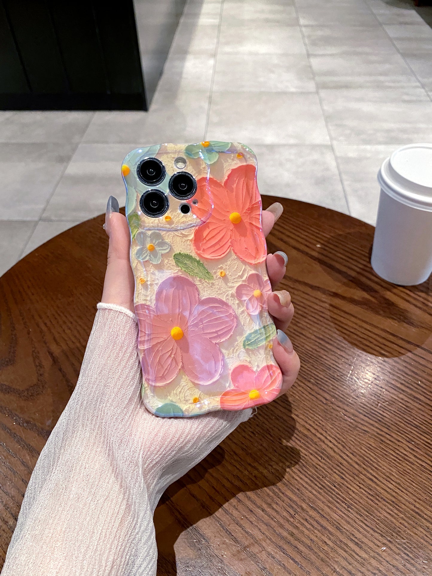 Coral & Purple Blooms iPhone Case in hand