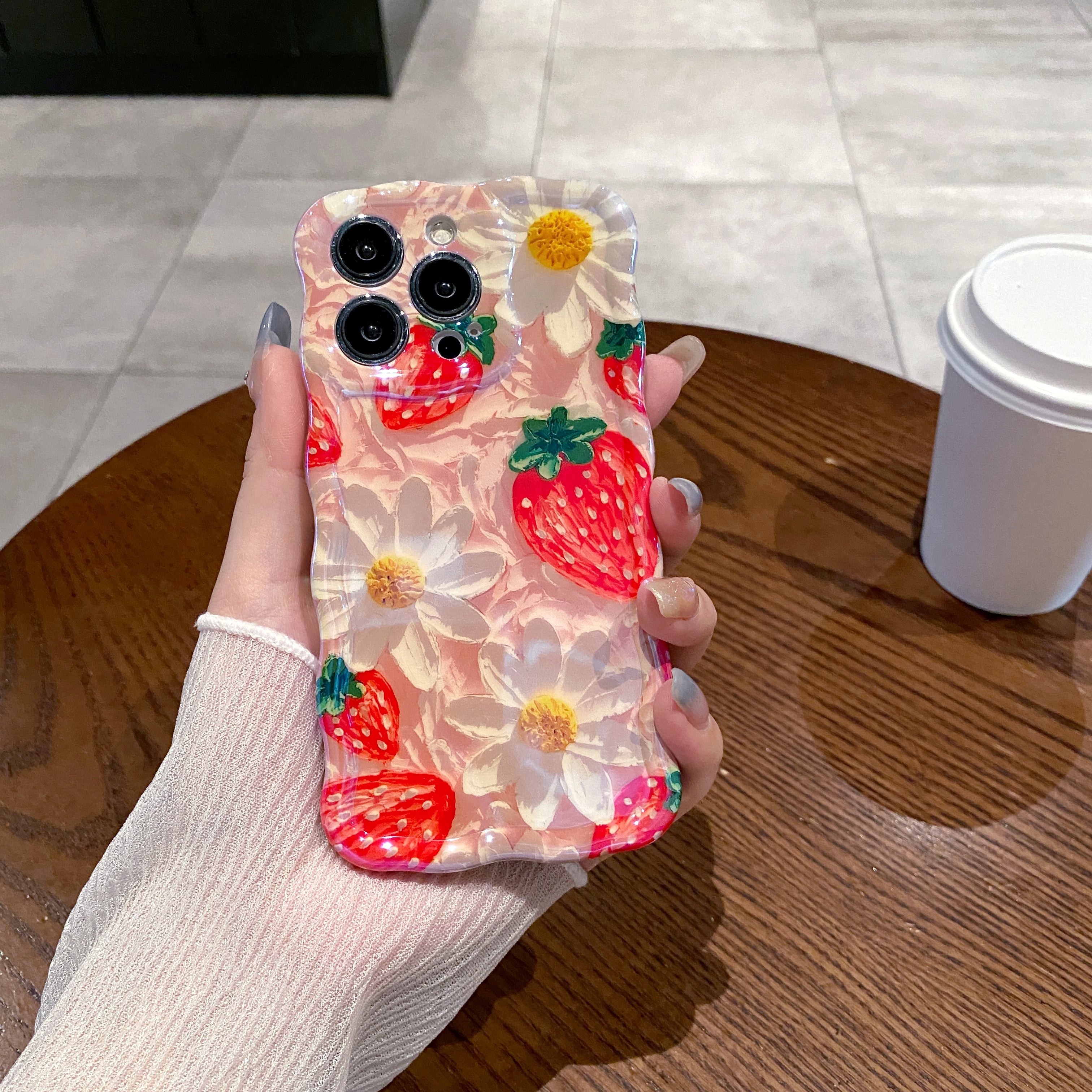 Strawberries & Daisies iPhone Case in hand