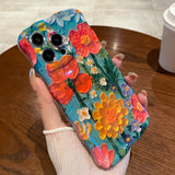 Teal Garden Blooms iPhone Case in hand