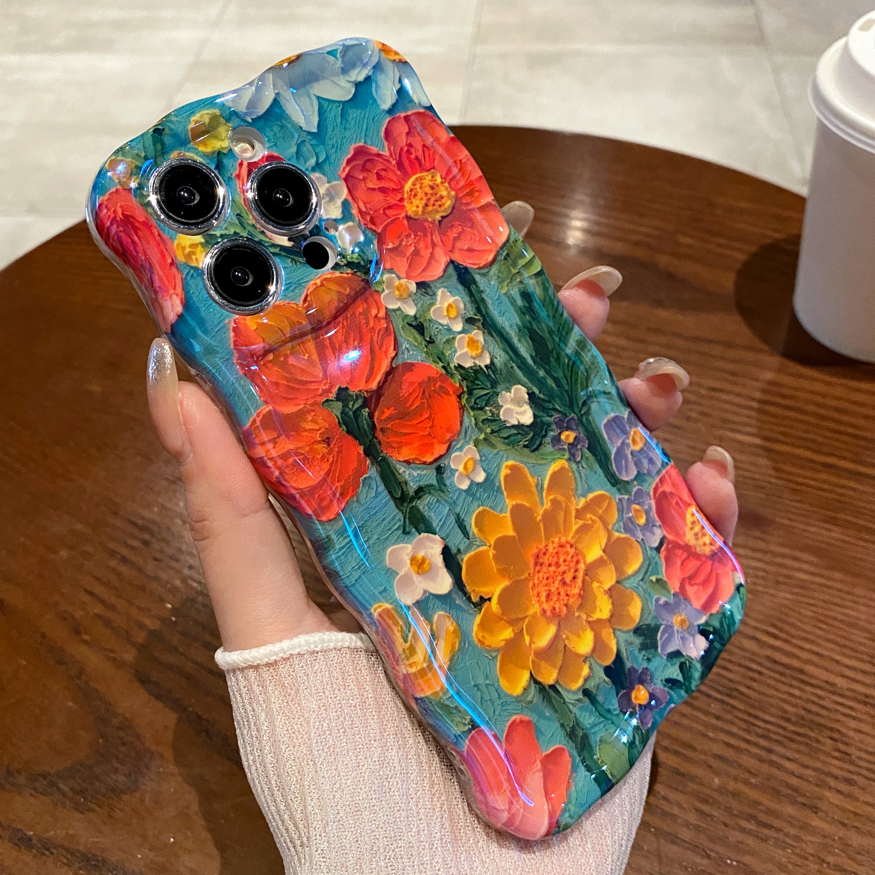 Teal Garden Blooms iPhone Case in hand
