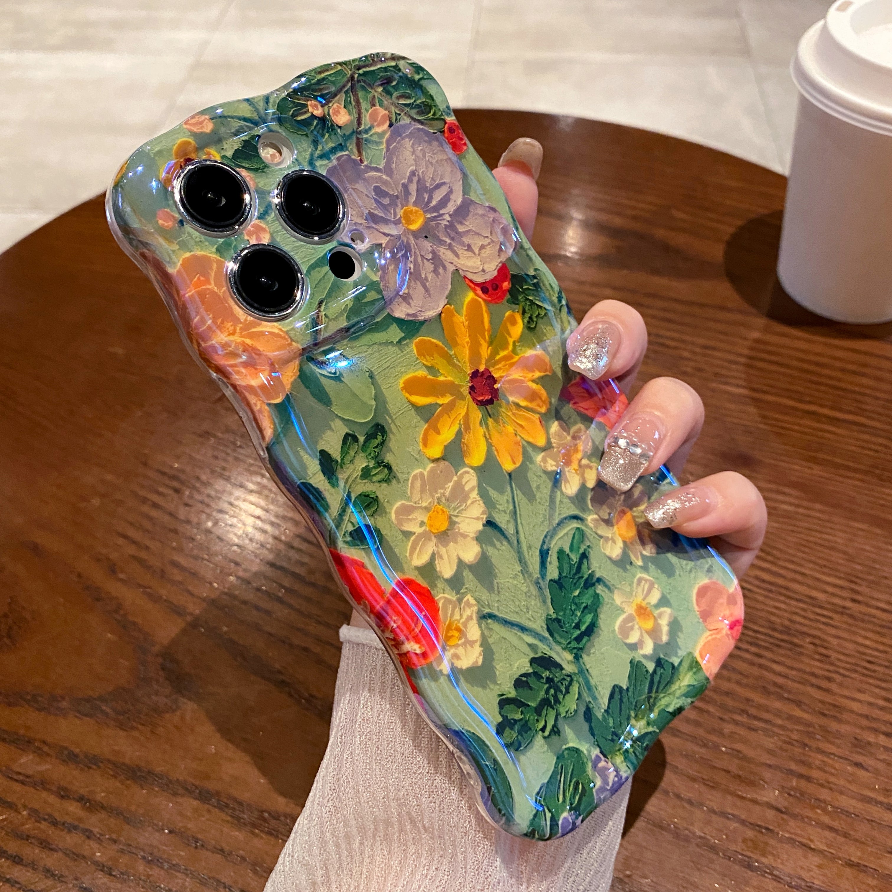 Green Meadow iPhone Case in hand