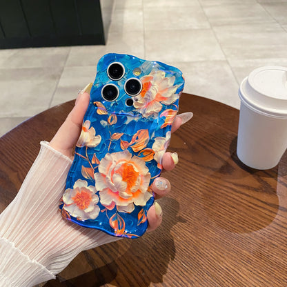 Tangerine Peony Blue iPhone Case in hand